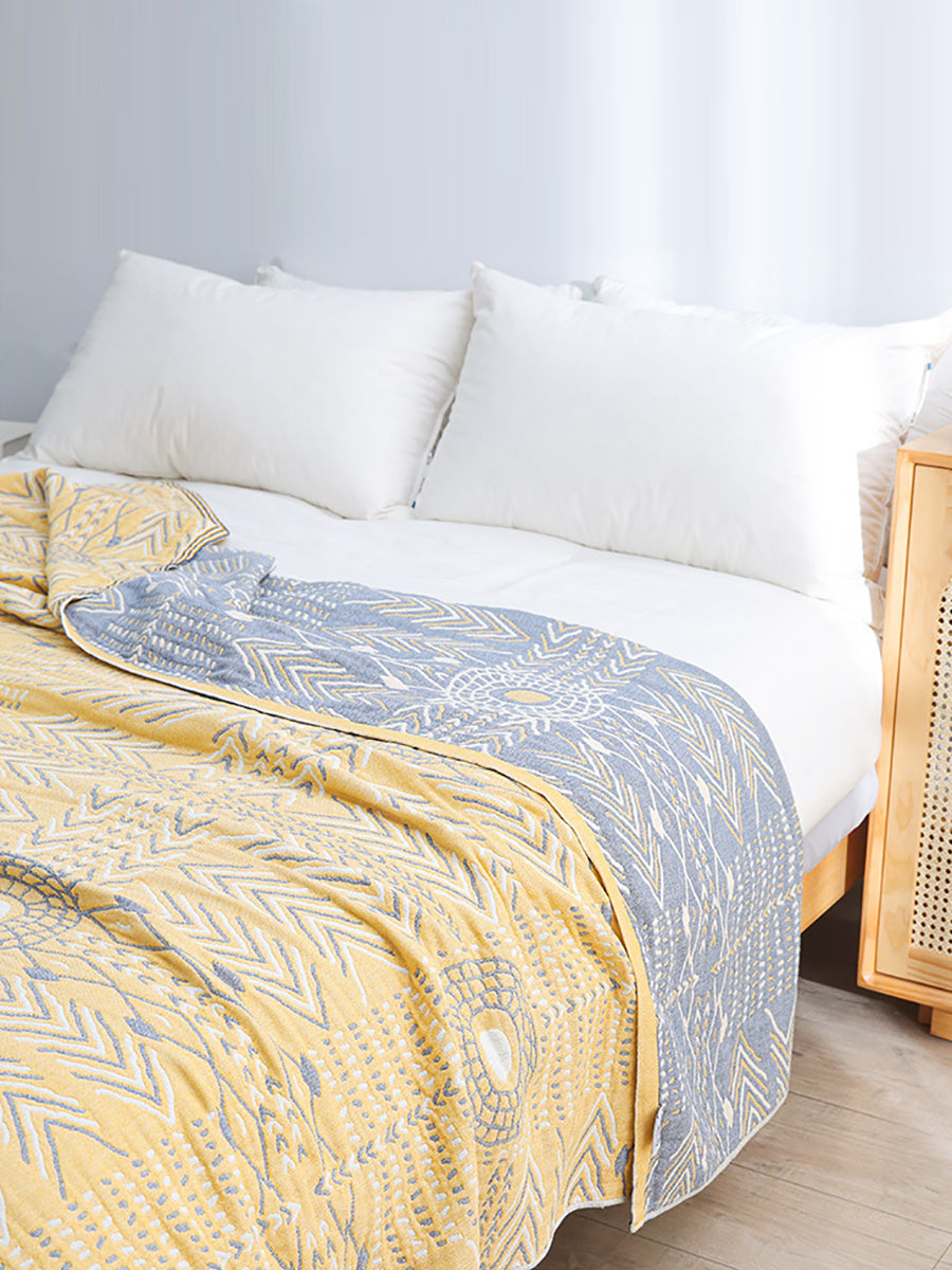 Couverture de canapé-lit tricotée géométrique à pompon en coton