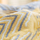Couverture de canapé-lit tricotée géométrique à pompon en coton